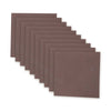A stack of brown chemical smoke magic paper sheets arranged in a diagonal fan pattern.