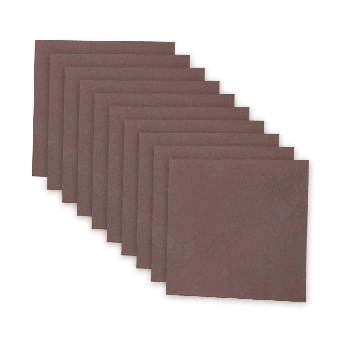 A stack of brown chemical smoke magic paper sheets arranged in a diagonal fan pattern.