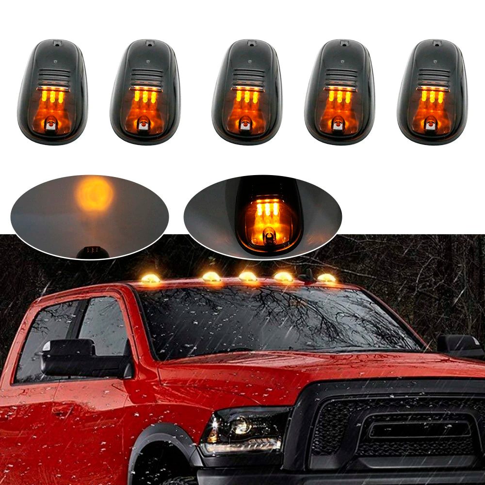 Set of five amber and white LED cab roof marker lights installed on a red truck.