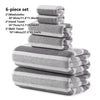 A gray and white 6-piece set of bath towels including washcloths and a bath towel stacked together.
