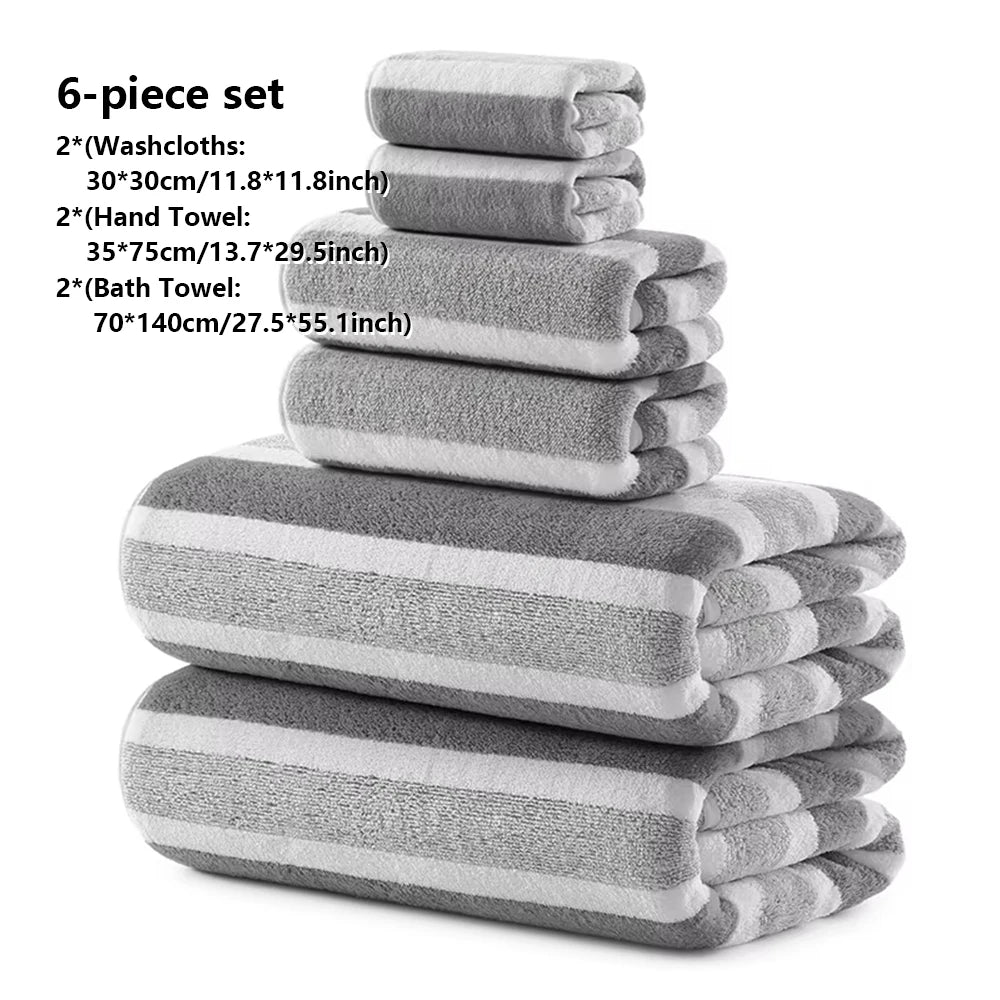 A gray and white 6-piece set of bath towels including washcloths and a bath towel stacked together.