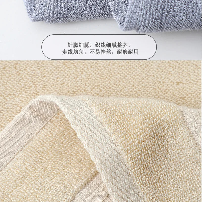 A close-up view of a beige cotton face towel fabric texture.