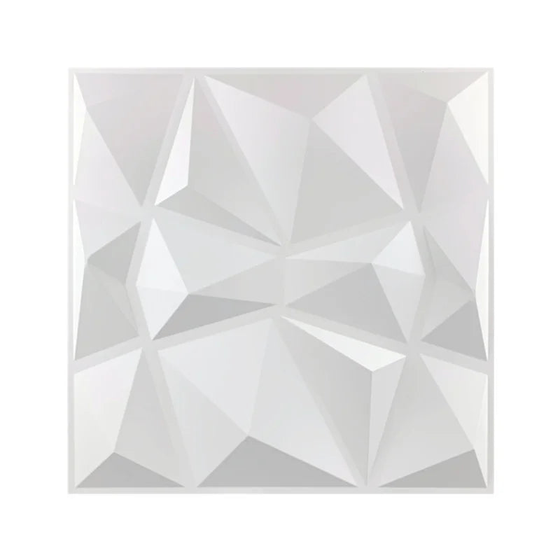 A close-up view of a white, geometric 3D diamond wall panel design.