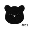 Un set de quatre éponges réutilisables pour enlever les poils d'animaux, en forme de visage de chat.