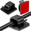 Black adhesive cable organizer clips used to manage and secure cables on desks and in homes.