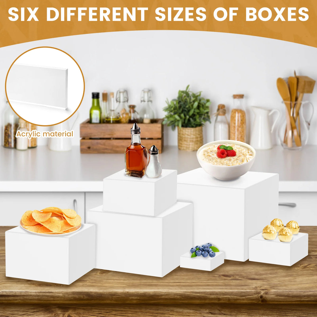 Six different sizes of white acrylic display risers stacked on a wooden table with various items.