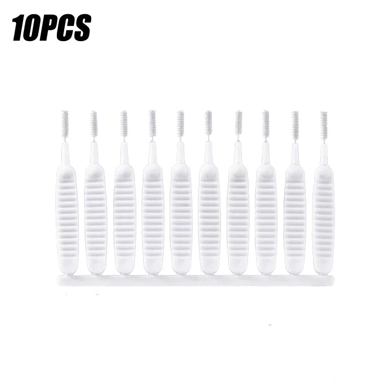 A set of ten white shower cleaning brushes with anti-clogging nozzles arranged in a row.