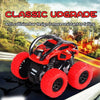 Red off-road stunt car with large tires and black chassis shown in a natural outdoor setting.