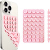 A pink silicone suction cup phone mount with multiple holes for hands-free use.