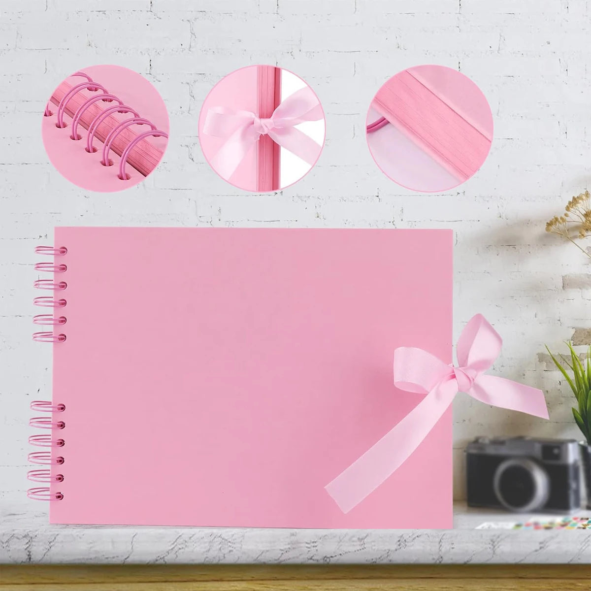 Pink scrapbook album with loose-leaf pages and decorative pink ribbon accents