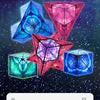 A collection of colorful 3D geometric cubes and pyramids, including a blue cube, a pink pyramid, and a red star shape, set ag