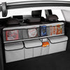 A foldable car trunk organizer with seat back storage is shown inside a car, featuring various storage compartments.