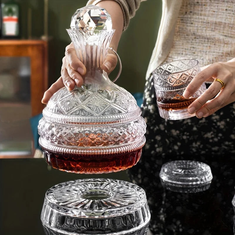 A person is pouring wine from a handcrafted crystal decanter into a glass, with a crystal aerator resting below.