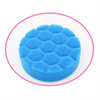A blue foam cleaning brush head set with sponge, scouring pad, and polishing discs shown in a circular view.