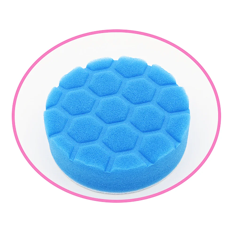 A blue foam cleaning brush head set with sponge, scouring pad, and polishing discs shown in a circular view.