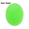 A small, bright lime green silicone ice face mask bowl with a textured surface.