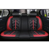 Black and red universal waterproof PU leather car seat covers installed in a vehicle interior.