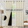 A pair of cream blackout curtains hanging in a window frame.