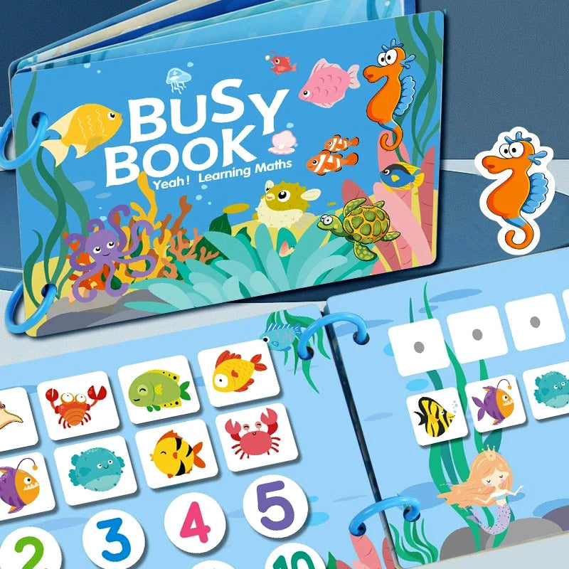 A colorful busy book for toddlers featuring animals, vehicles, and dinosaurs with interactive learning elements.