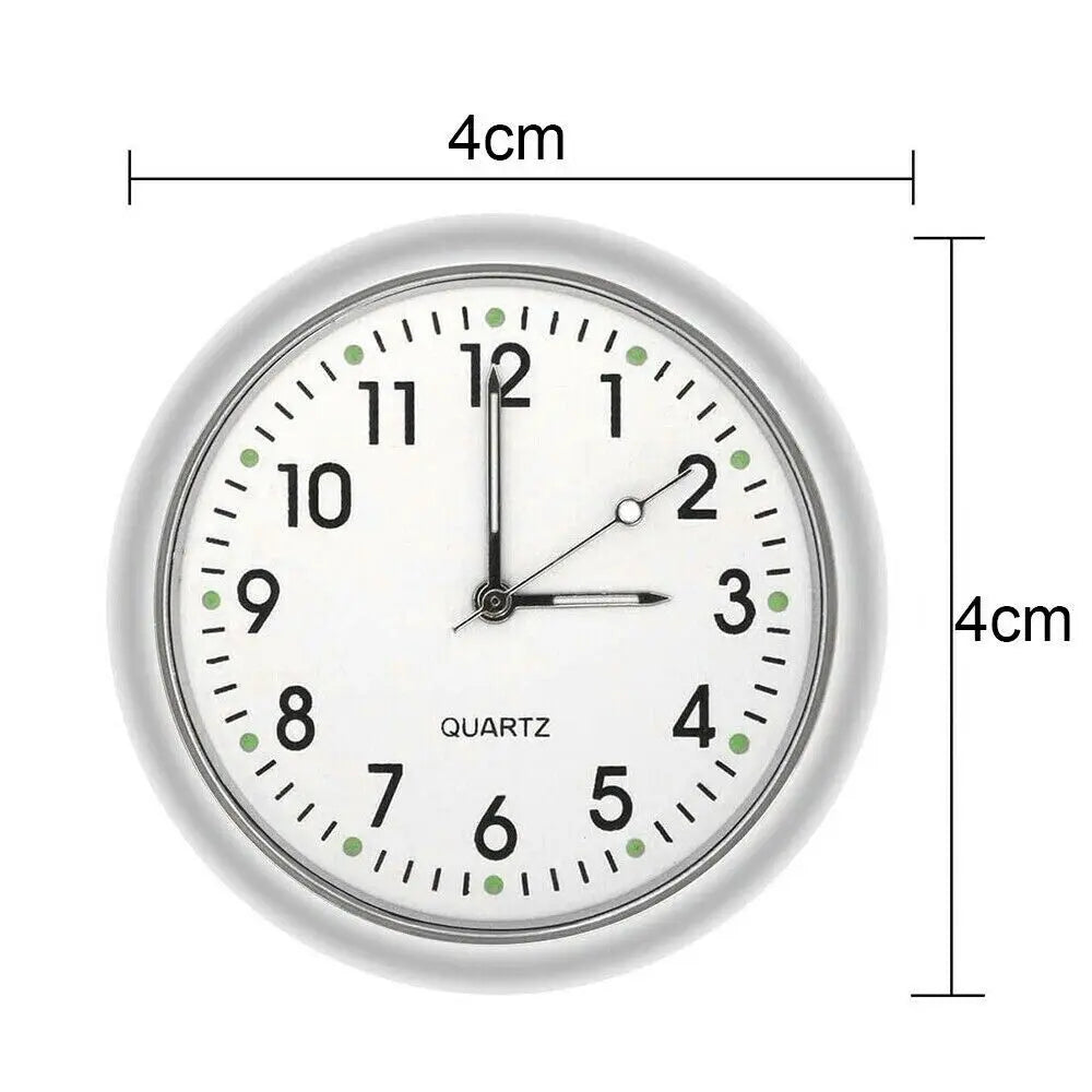 A white mini quartz clock face showing the time, with a 4cm diameter and luminous hands.