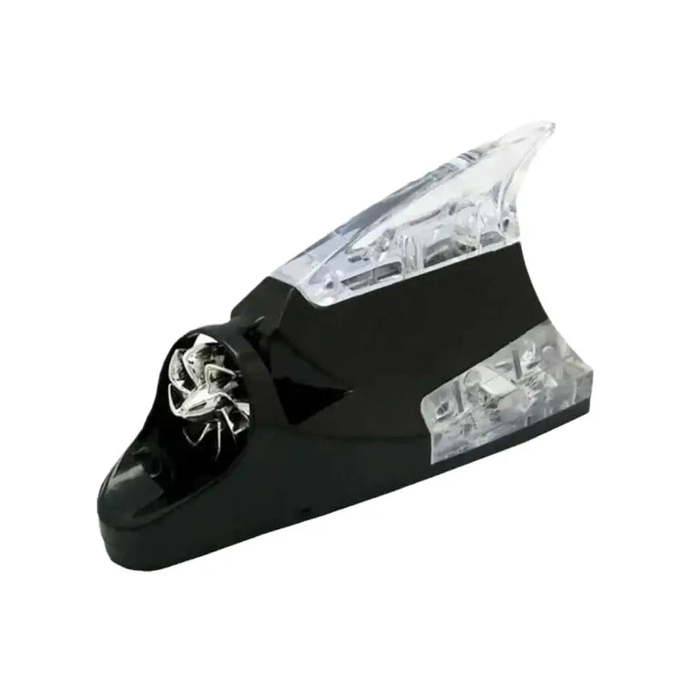 A black wind-powered LED antenna light for vehicles with a clear protective cover.