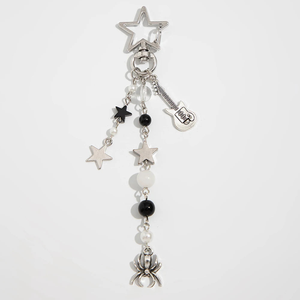 Silver charm featuring a star, guitar pick, and pearl bowknot detail.