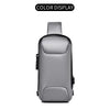 Bolso cruz para hombre gris multifuncional anti-robo, mostrado contra fondo blanco.