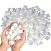 A hand holds a package of compressed disposable towels for face and skin care