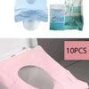 Various packs of disposable toilet seat covers in blue, pink, and mint green for potty training and travel use