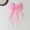 Pink lace bow hair clip for women with a delicate floral pattern