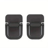 A pair of black minimal aluminum laptop risers with adhesive mounting pads.