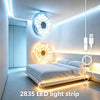 A modern bedroom featuring a bed illuminated by a 2835 LED light strip and decorative circular lights.
