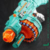 A teal electric burst soft bullet gun toy with an orange firing mechanism and a circular barrel is shown against a dark backg