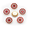 A collection of red and clear flower-shaped rhinestones, including large, round, and clustered designs.