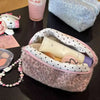 A leopard print cosmetic bag with a plush lining is shown open, revealing skincare products.
