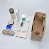 A collection of felt insert liners and accessories for handbags, including various colored and shaped inserts.