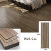 Close-up view of brown wood grain floor tiles installed in a room, showing texture and installation detail.