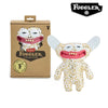 A plush toy of an ugly monster with funny teeth and leopard print fur, packaged in a brown box.