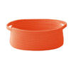 An orange handwoven rope storage basket with handles.