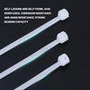 Three white nylon self-locking cable ties are shown against a dark background.