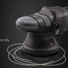 A black dual action polisher with an orbit attachment is shown against a dark background, highlighting vibration inhibition t