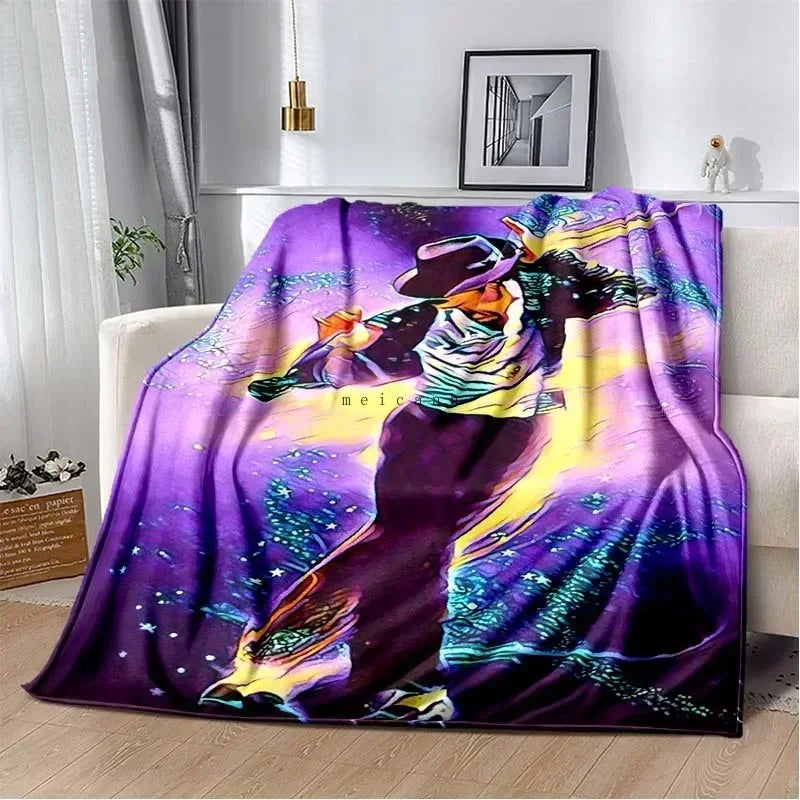 A purple and black flannel throw blanket featuring a vibrant graphic print of Michael Jackson.