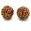 A pair of round, textured amber crystal clay beads for DIY jewelry and craft projects.