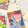 A collection of colorful alcohol markers and art supplies laid out on a light background.