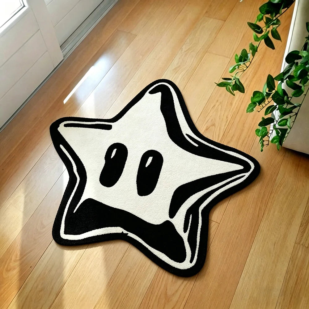 A black star-shaped rug with a white background lying on a light wooden floor.