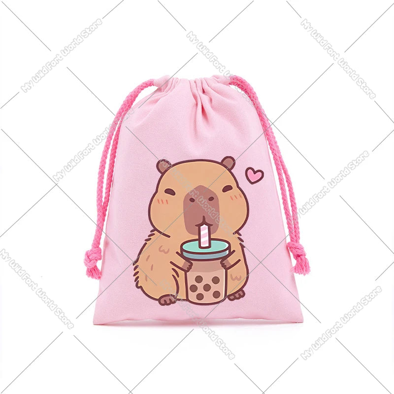 A pink drawstring storage bag featuring a cute cartoon capybara holding a cup.