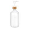 A white refillable soap dispenser bottle with a wooden pump top.