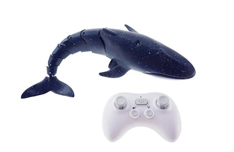 A dark blue shark toy with a fin and a white remote control gamepad.