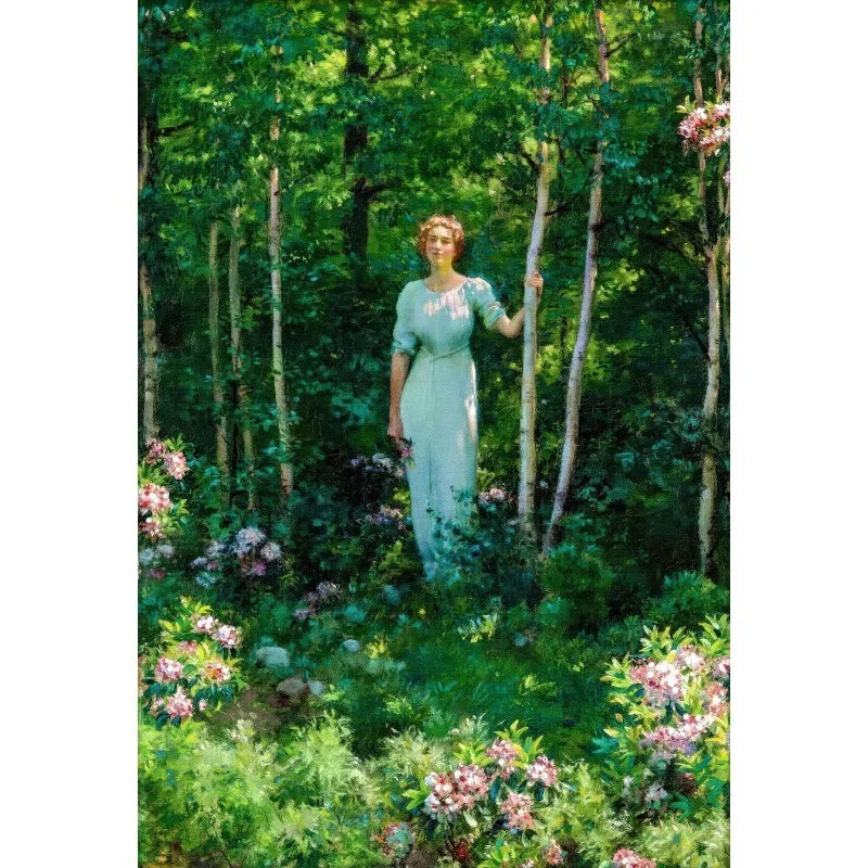 An ethereal portrait of a woman in a light green dress standing among lush green trees and flowers.