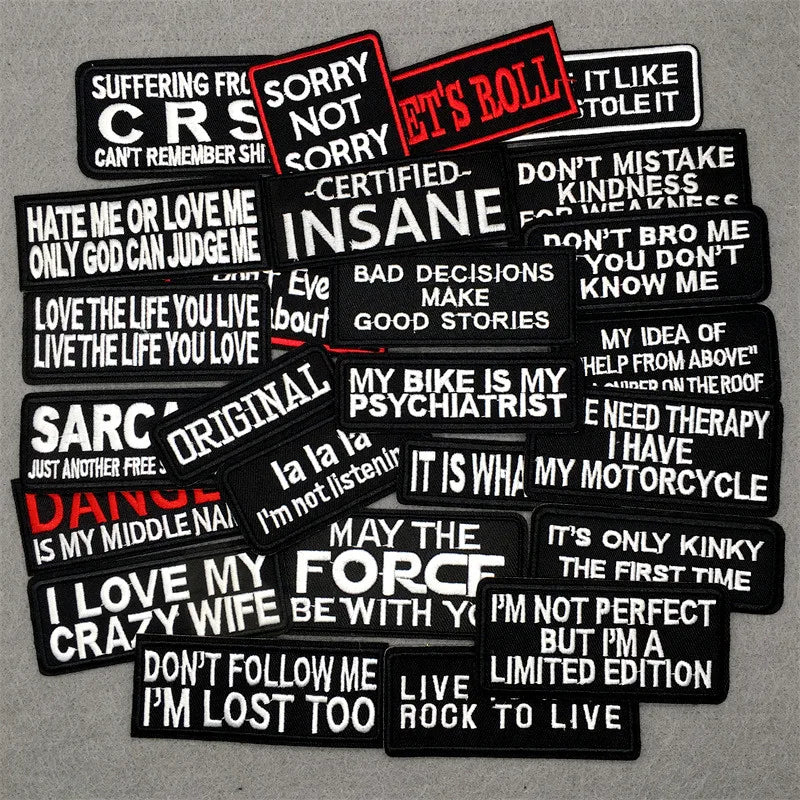 A collection of black text embroidery patches featuring various phrases like SORRY NOT SORRY IT'S A BOLL and I LOVE MY CRAZY 